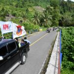 Bendera Pataka Perjuangan KPK Gorontalo Utara di Arak Dari Kecamatan Tolinggula
